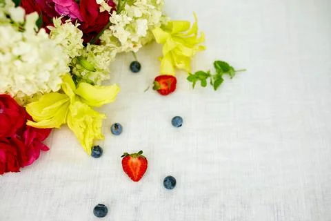 Summer background flat lay hydrangea bouquet and berry Stock Photos