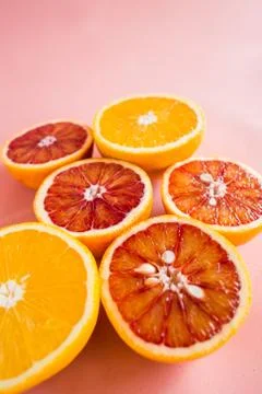 Summer background half of citrus. Creative summer pink background. Stock Photos