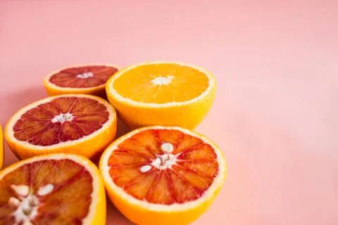 Summer background half of citrus. Creative summer pink background. Stock Photos