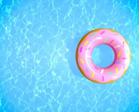 Summer background inflatable rubber donut ring on blue water swimming pool Stock Photos