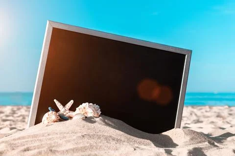 Summer background table. Globe, seashell, airplane and starfish near black de Stock Photos
