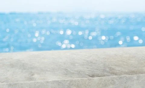 Summer background.Empty diagonal grunge concrete table with blur sea and sky  Stock Photos