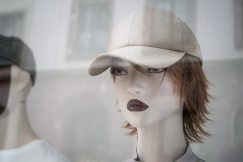 Summer base ball hat on the head of mannequin in a fashion store.. Stock Photos