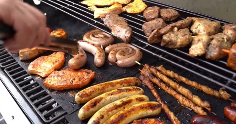 Summer bbq backyard grill barbecue food cooking meal garden family Stock Footage 336576042