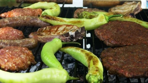Summer Bbq grill T-bone steak and burgers Stock Footage