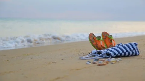 Summer beach accessories on the sandy beach Stock Footage 93907458