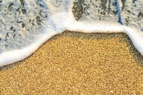 Summer Beach Background with Sea Waves and Sand. Travel and Vacation Concept. Stock Photos