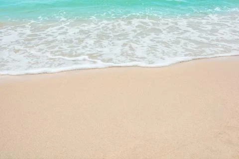 Summer beach concept - Soft wave of sea on empty sandy beach Background with  Stock Photos