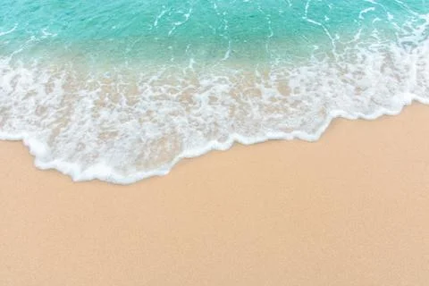 Summer beach concept - Soft wave of sea on empty sandy beach Background with  Stock Photos