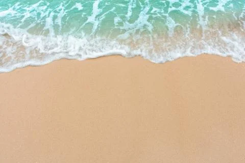 Summer beach concept - Soft wave of sea on empty sandy beach Background with  Stock Photos