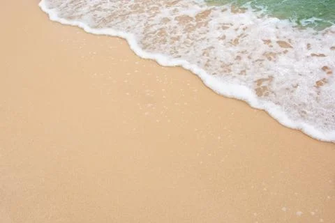 Summer beach concept - Soft wave of sea on empty sandy beach Background with  Stock Photos