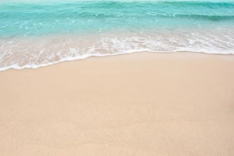 Summer beach concept - Soft wave of sea on empty sandy beach Background with  Stock-Fotos