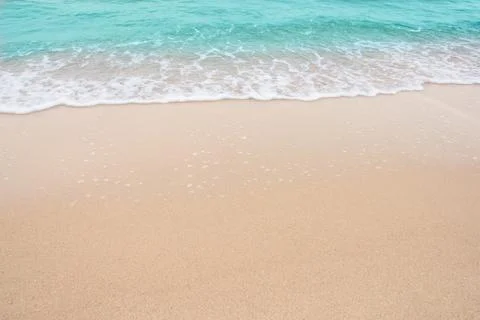 Summer beach concept - Soft wave of sea on empty sandy beach Background with  Stock Photos