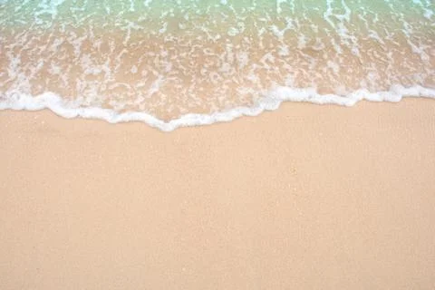 Summer beach concept - Soft wave of sea on empty sandy beach Background with  Stock Photos