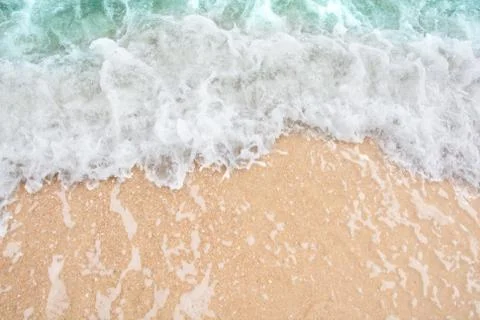 Summer beach concept - Soft wave of sea on empty sandy beach Background with  Stock Photos