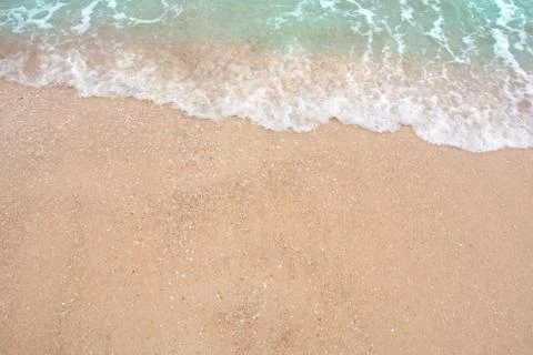 Summer beach concept - Soft wave of sea on empty sandy beach Background with  Stock Photos