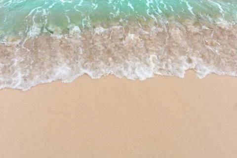 Summer beach concept - Soft wave of sea on empty sandy beach Background with  Stock Photos