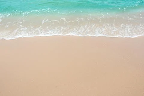 Summer beach concept - Soft wave of sea on empty sandy beach Background with  Stock Photos