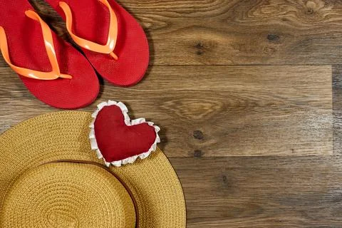 Summer Beach Essentials Featuring Flip-Flops, Straw Hat Stock Photos