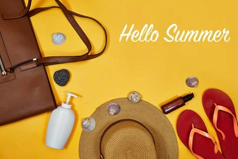 Summer Beach Essentials Flat Lay With Straw Hat, Sunscreen, Flip-Flops and Brown Stock Photos