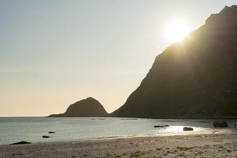 Summer beach with setting sun at Haukland Beach Lofoten Islands Stock Photos