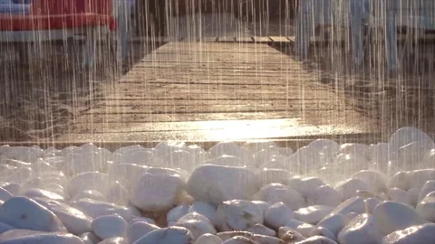 Summer beach shower in bright evening sunlight. Wall tropical rain, drops fall Stock Footage 138894534