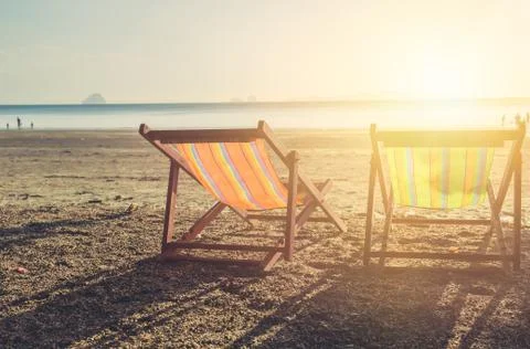 Summer beach sunset with empty couple bed travel background. Stock-Fotos