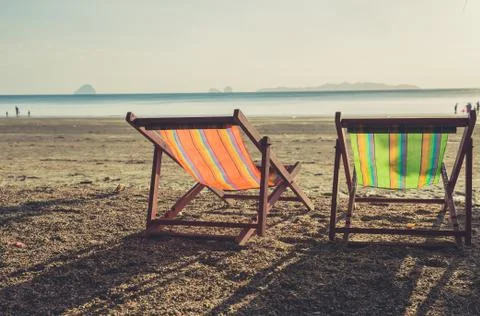 Summer beach sunset with empty couple bed travel background. Stock-Fotos