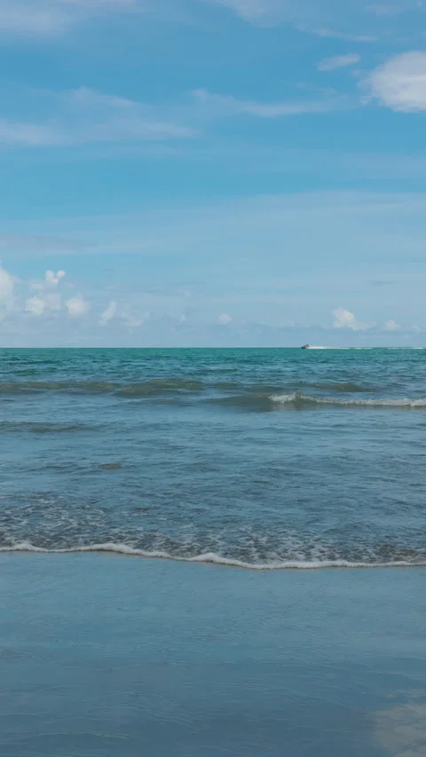 Summer beach waves with jet ski on the horizon Stock Footage 315066772