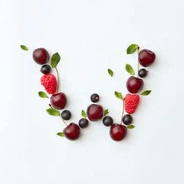 Summer berries pattern of letter W english alphabet from natural ripe berries - Stock-Fotos