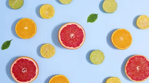 Summer blinking pattern made of citrus fruits and green leaves, Stop motionv Video stock 152542248