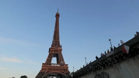 Summer blue sky Paris Eiffel Tower travelling under bridge Pont d'Iéna Stock Footage 207567307