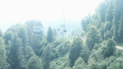 Summer. Cable car trailers take tourists to the top Stock Footage 238424503