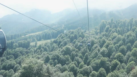 Summer. Cable car trailers take tourists to the top Stock Footage 238424554