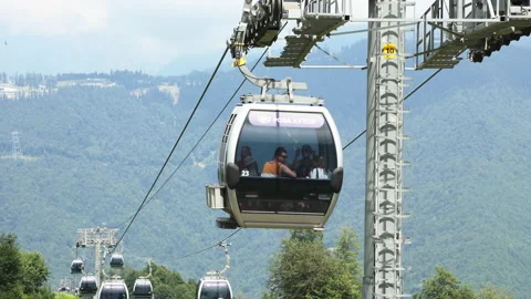 Summer. Cable car trailers take tourists to the top Stock Footage 238424626