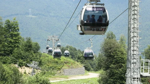 Summer. Cable car trailers take tourists to the top Stock Footage 238424689