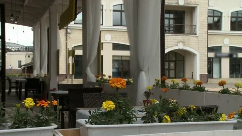 Summer cafe terrace on a windy day Stock Footage 79554570