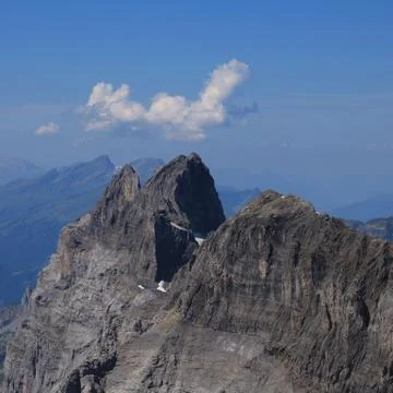 Summer cloud over a mountain peak Stock Photos