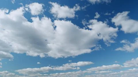 Summer clouds float across blue sky. Blue sky white clouds. Timelapse. 스톡 사진