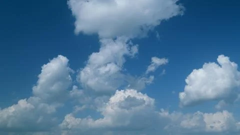 Summer clouds float across blue sky. Blue sky white clouds. Timelapse. 스톡 사진