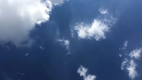 Summer Clouds fly across a royal blue sky. Stock Footage 90652514