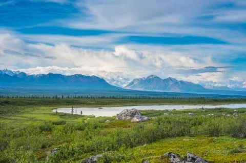 Summer clouds over the Alaska Range as seen from the Alaska Highway in South-cen Stock Photos