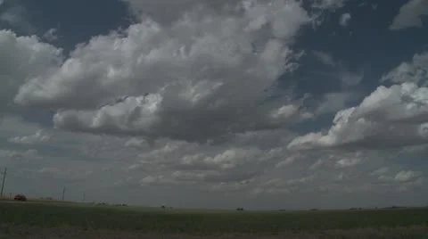 Summer clouds over green farm land. Cumulus clouds. Stock Footage 11407437