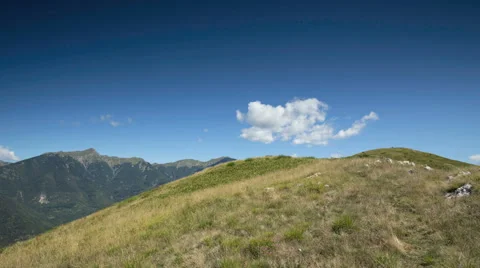 Summer clouds over a hill time lapse Stock Footage 44797512