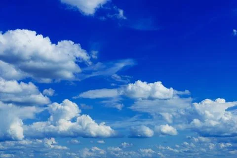 Summer cloudy blue sky Stock Photos