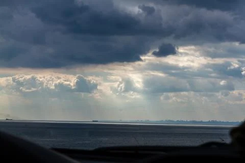 Summer cloudy sky over the sea Stock Photos