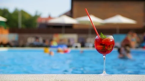 Summer cocktail on the background of the pool Stock-Footage 93483440