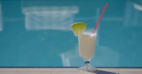 Summer cocktail by the pool Stock Footage 83577255