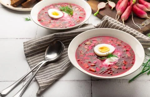 Summer cold beetroot soup with sour cream and egg Stock Photos