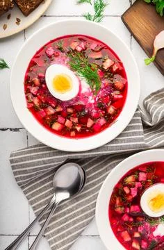 Summer cold beetroot soup with sour cream and egg Stock Photos